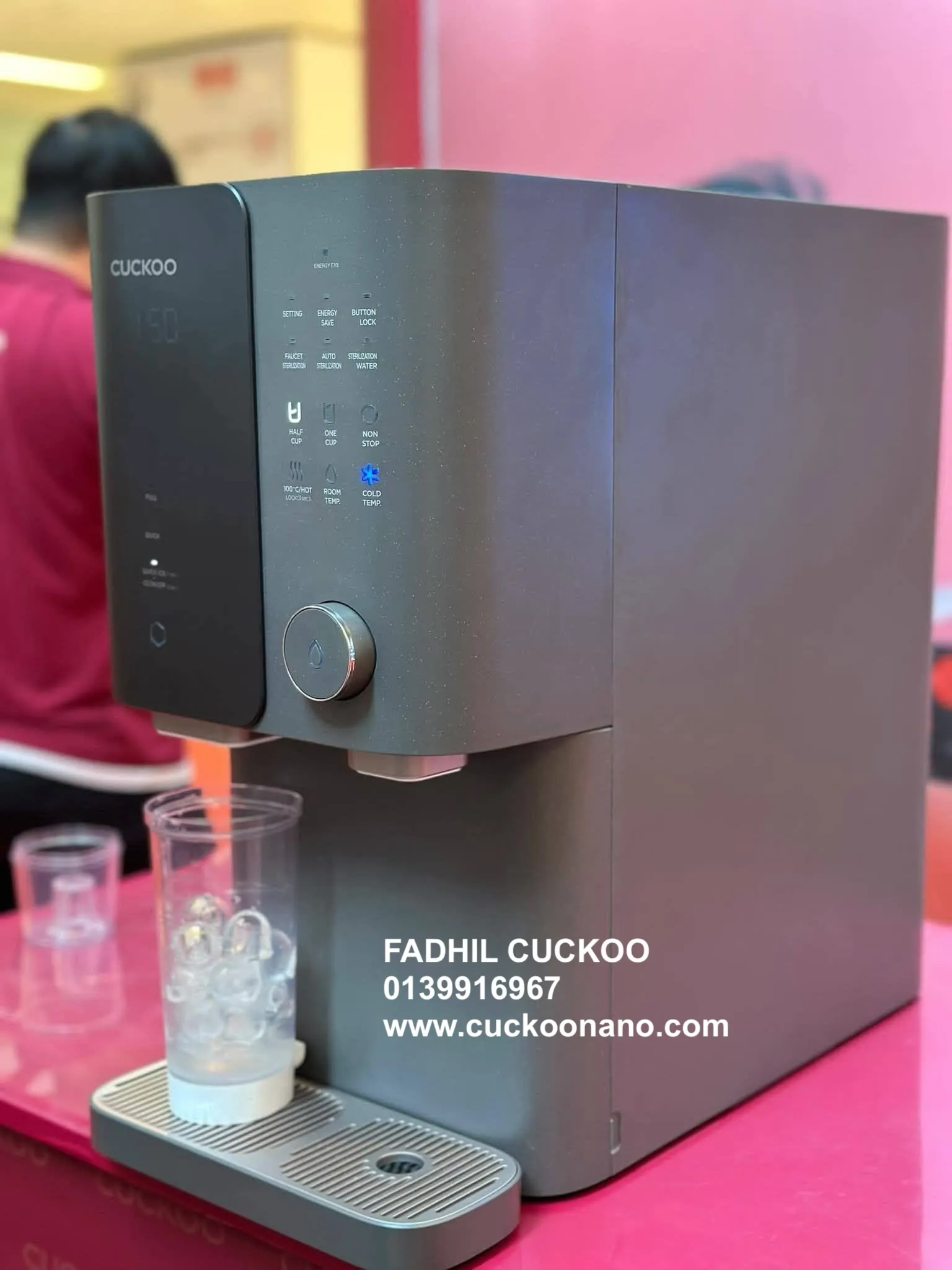 CUCKOO Granite Ice-Making Water Purifier dispensing ice into glass